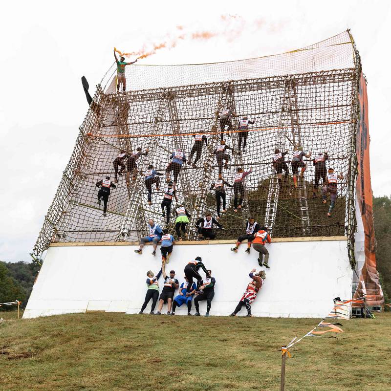Photo of participants completing Tough Mudder Obstacle race